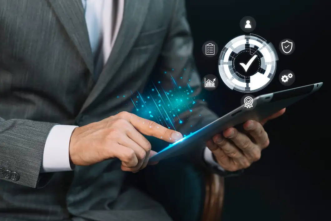 businessman in a suit interacts with a tablet