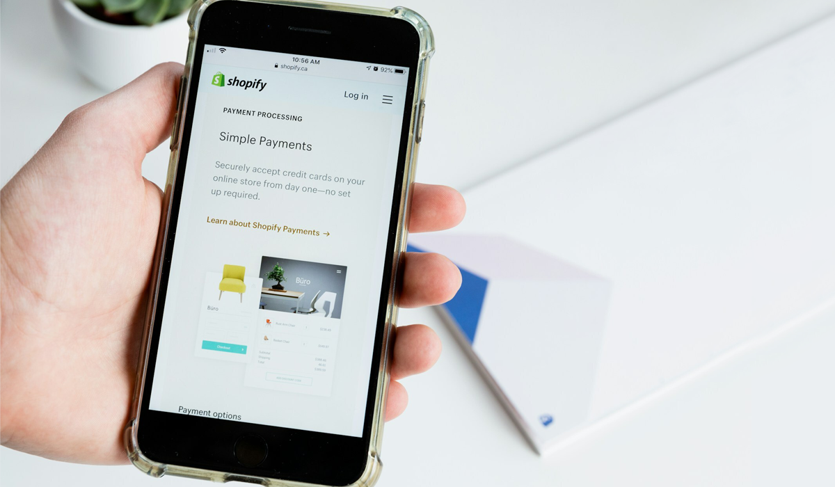 a phone screen with shopify payment option